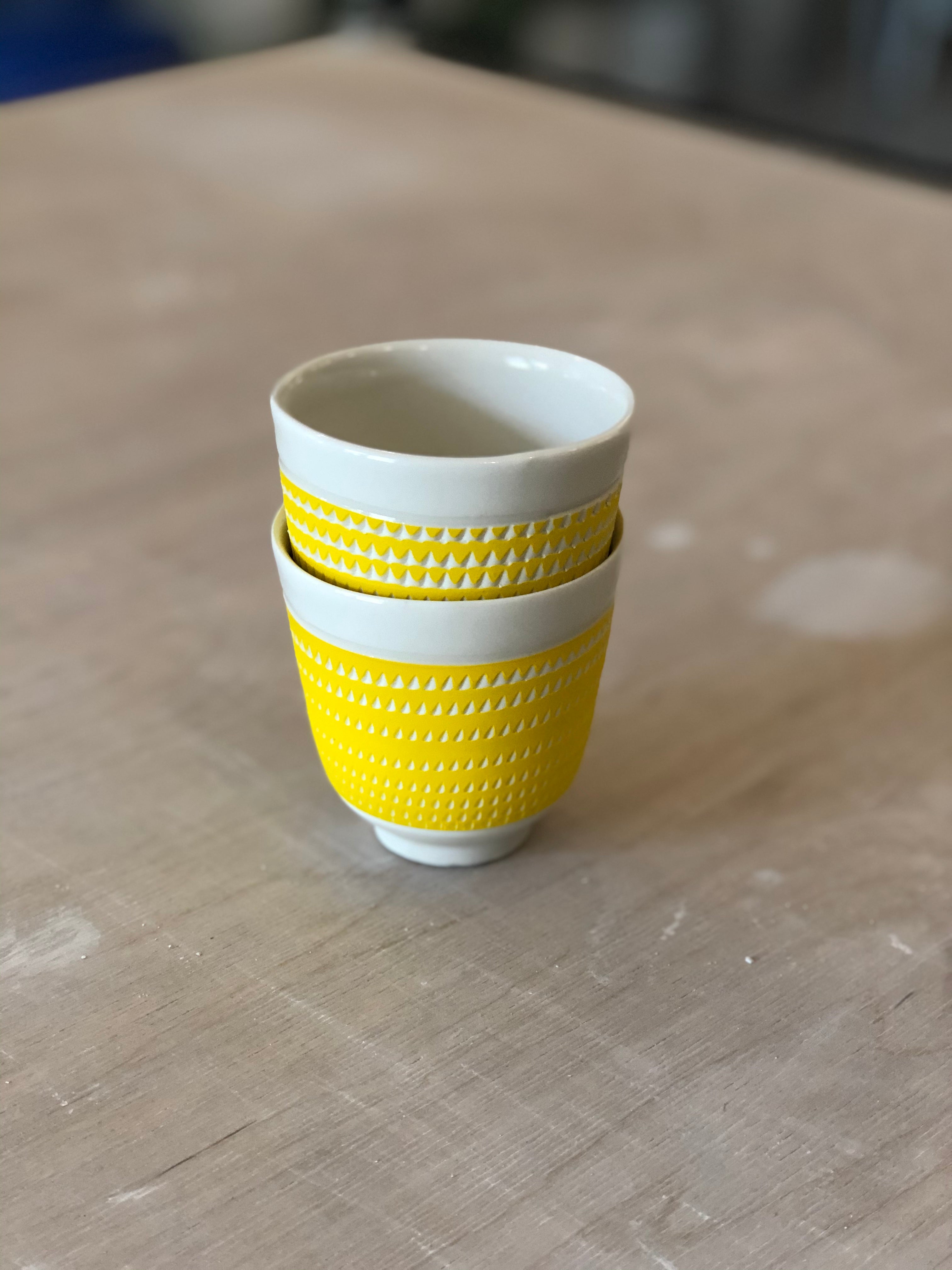 Porcelain cup with chattering decoration /  Black