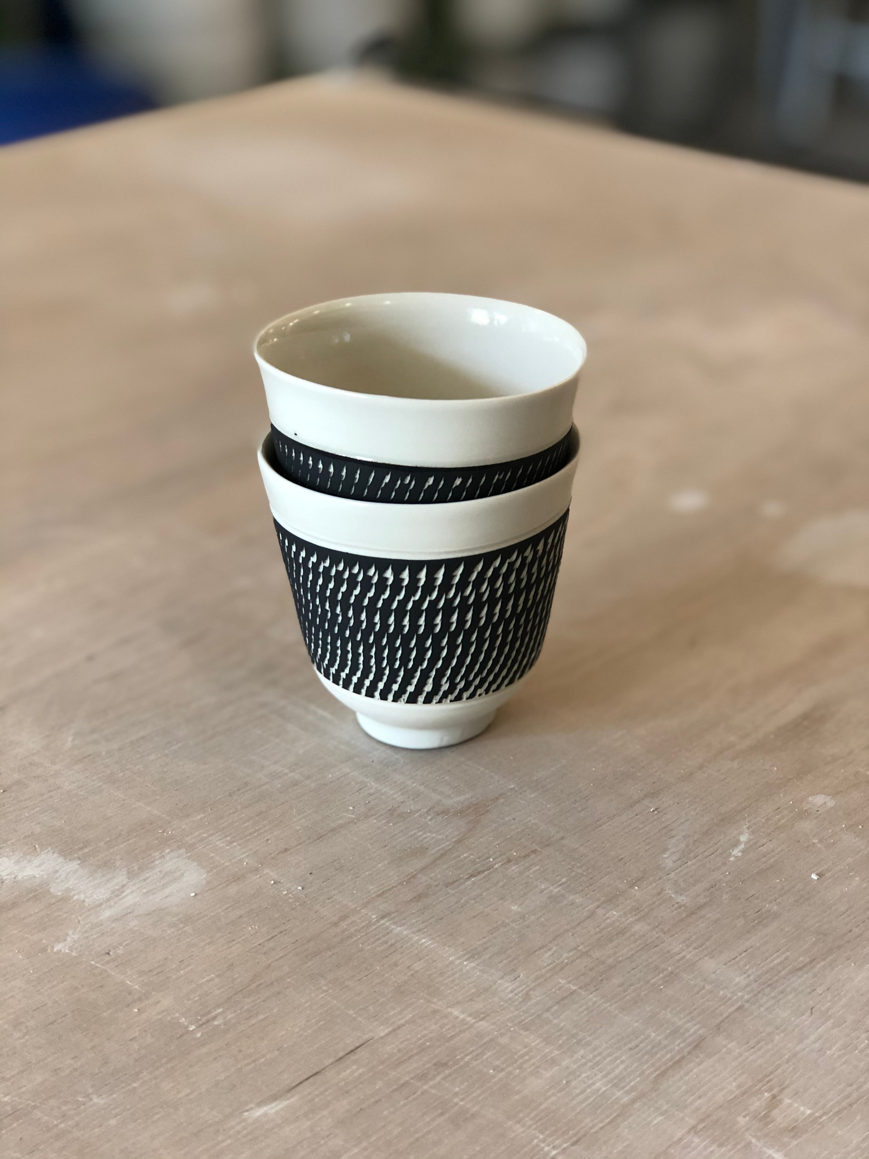 Porcelain cup with chattering decoration /  Orange